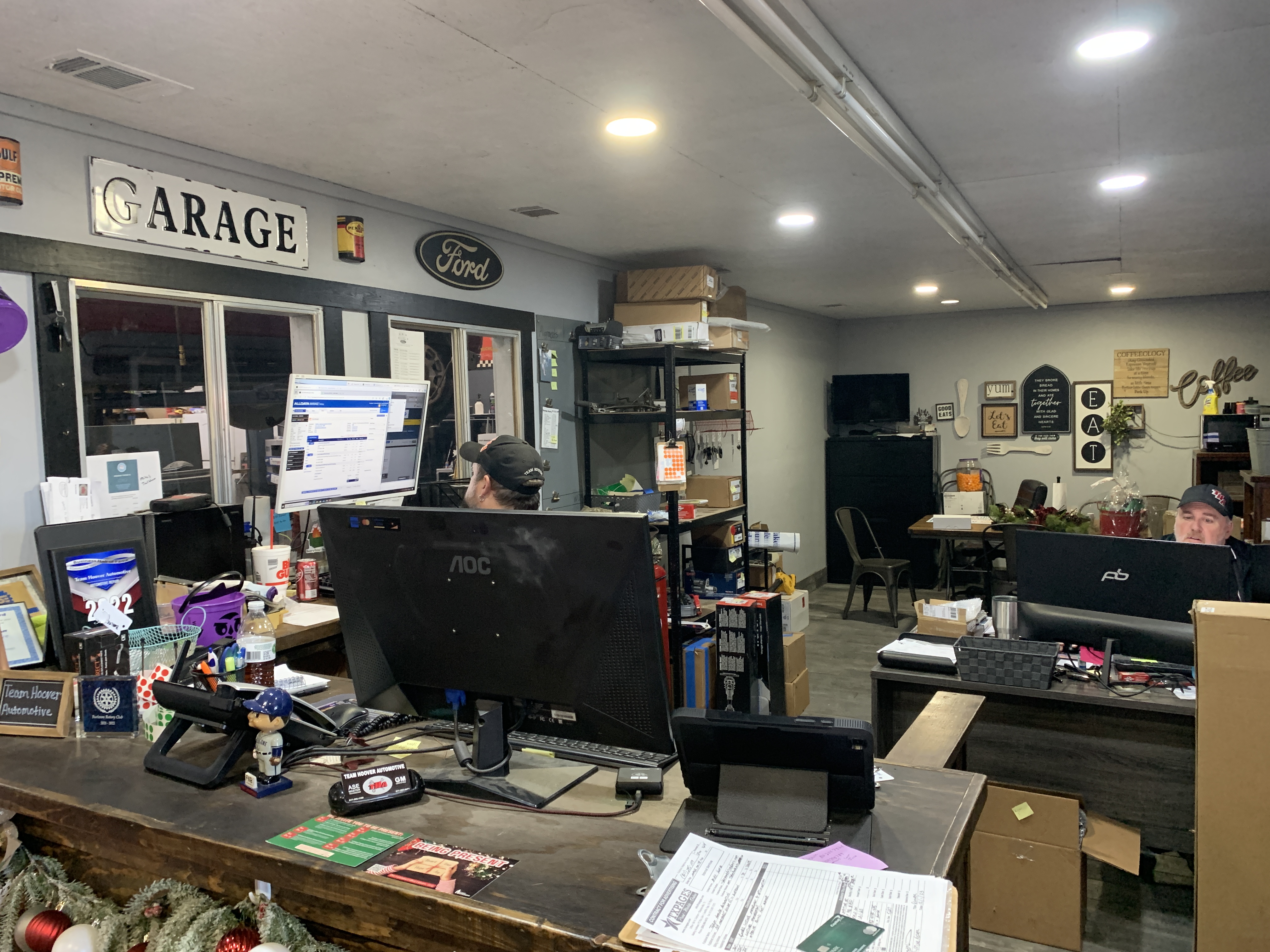 Professional auto repair shop bay with lift and diagnostic equipment